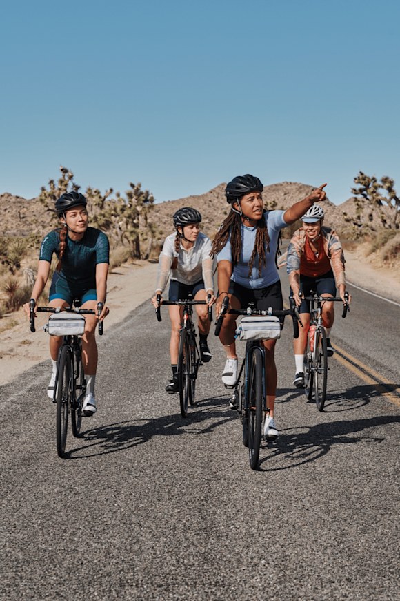 Four cyclists on bikes Four cyclists on bikes